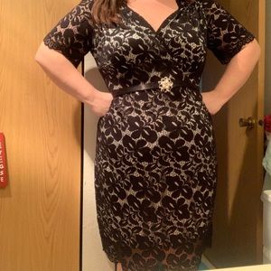 Black lace dress with belt. Knee length withsleves